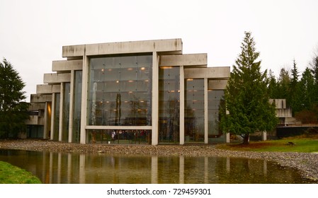 Vancouver, British Columbia, Canada, 2012. Museum Of Anthropology At UBC Designed By Arthur Erickson, Exterior View From The Garden With Totem Poles