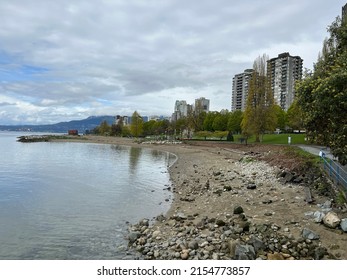 Vancouver, British Columbia, Canada - April 25, 2022: Vancouver Sunset Beach near Burrard Bridge. The popular seawall along False Creek.