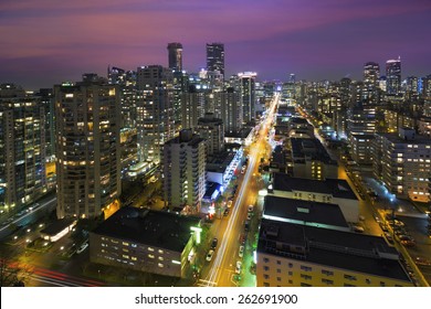 Vancouver British Columbia Canada Cityscape Along Robson Street At  Night Aerial View