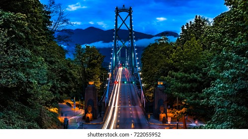 Vancouver, British Columbia. Canada View from above of the Lions Gate Bridge with lights trail, glitters and clouds.  - Powered by Shutterstock