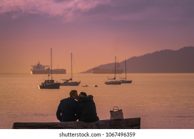 Vancouver British Columbia Canada,April 2018.couple Kiss On The Beach With Sunset Sky Backgrounds