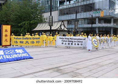 Vancouver, British Columbia, Canada-July 17, 2021:  Demonstrators For Stopping The Persecution Of FalunGong In China Holding A Sign That Falun Dafa Is Great In Front Of Vancouver Art Gallery.