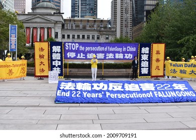 Vancouver, British Columbia, Canada-July 17, 2021:  Demonstrator Giving A Speech In Front Of A Sign To End 22 Years' Persecution Of FalunGong In China In Front Of The Vancouver Art Gallery.