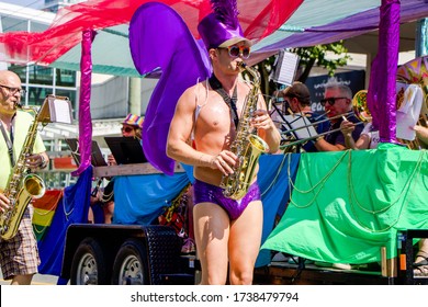 Vancouver, British Columbia/Canada - 08/05/2018: Man Playing A Saxaphone In Purple Swim Briefs At The Annual Gay Pride Parade In Vancouver.