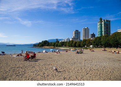 Vancouver, Canada 08.16.2021 - English Bay Coast Beach, Summer Beach People Lifestyle Happy Couple Enjoying Sunset