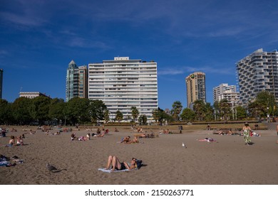 Vancouver, Canada 08.16.2021 - English Bay Coast Beach, Summer Time. People Chill Out On Beach Dountown