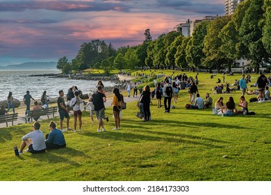 Vancouver, Canada - 7-6-2022: People Relaxing On A Sunny Afternoon On English Bay Beach Adjacent To Stanley Park, Vancluver, BC, Canada