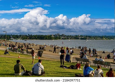 Vancouver, Canada - 7-6-2022: People Relaxing On A Sunny Afternoon On English Bay Beach Adjacent To Stanley Park, Vancluver, BC, Canada