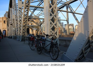 VANCOUVER, CANADA - Apr 04, 2021: A beautiful shot of two bikes on Burrard Bridge in Vancouver, Canada