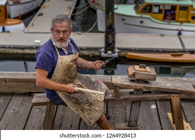 Vancouver, Canada - Aug 22, 2018. A Craftman Is Making Parts For A Selling Ship At Waterfront