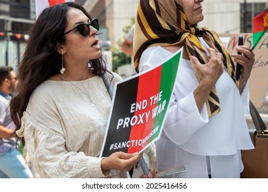 Vancouver, Canada - August 14,2021: Woman Is Holding A Sign End The Proxy War Outside Of Vancouver Art Gallery