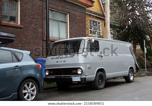 VANCOUVER, CANADA - Mar 07, 2021:\
Vintage grey van in East Vancouver, British Columbia,\
Canada
