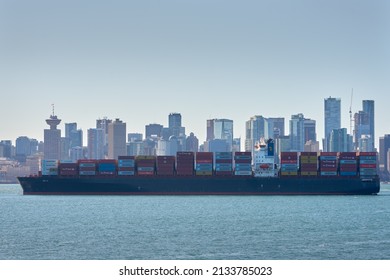 Vancouver, Canada – March 5, 2022. Burrard Inlet Loaded Freighter. A loaded freighter anchored in Burrard Inlet. Vancouver, British Columbia, Canada. Editorial.

                               