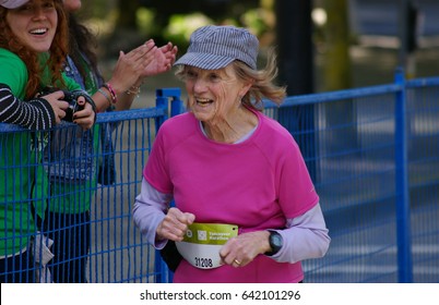 Vancouver, Canada - May 7, 2017: An Unidentified Older Woman Running In The BMO Vancouver Marathon Runs Up The Final Hill Towards The Finish Line.