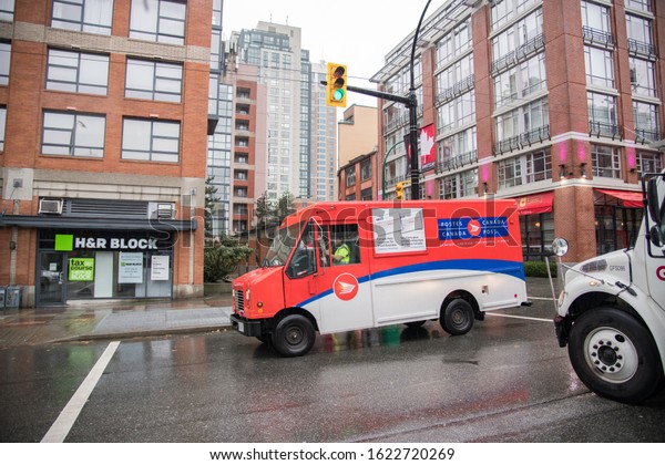 Vancouver, Canada: October 18, 2019: A Canada\
Post truck in the city of Vancouver, Canada. Canada Post has 64,000\
employees.