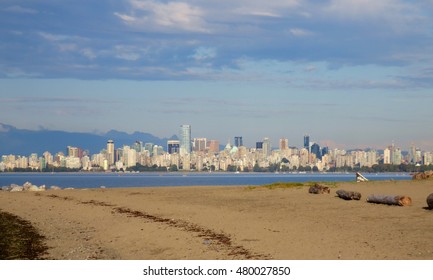 Vancouver City Scape View From Kitsilano Beach On A Cloudy Day