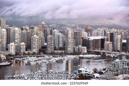 Vancouver downtown snow in winter. Cambie bridge. False Creek with boats. British Columbia. Canada - Powered by Shutterstock