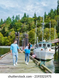 Vancouver Island, Canada, Quadra Island Old Harbor With Fishing Boat At Cape Mudge, A Couple On Vacation At Vancouver Island. Canada.