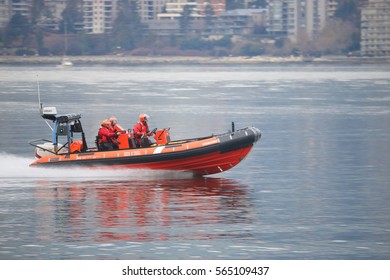 VANCOUVER - JANUARY 26, 2017: Members of the Canada Coast Guard respond to a distress call in Vancouver on January 26, 2017.
