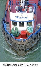 VANCOUVER - July 28, 2017: A Tug Boat Captain Stands On Deck Communicating And Coordinating With Other Tug Boats Active On Vancouver's Fraser River On July 28, 2017.