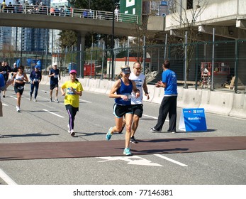 VANCOUVER - MAY 1: Elane Lowry From Calgary, Michael Misner And Yukie Maekawa  Approach The Finish Of The 2011 BMO 40th Annual Vancouver Marathon On May 1, 2011 In Vancouver, Canada.