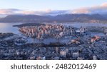 Vancouver skyline at sunset with snowy mountains