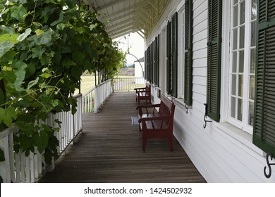 Vancouver, WA USA – June 14, 2019: The Long Porch In Front Of The Chief Factor's Residence Offer A Cool Rest Spot At Reproduction Hudson Bay Co. Fort Vancouver.