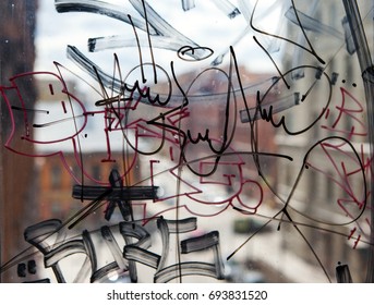 Vandal Graffiti On The Window Of A House