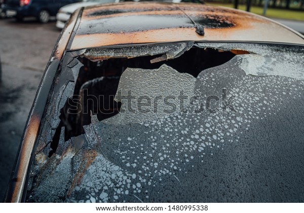 Vandalism or\
revenge, burnt car. The consequences of popular protest, burnt car,\
a crime. Car after fire. Auto\
trash