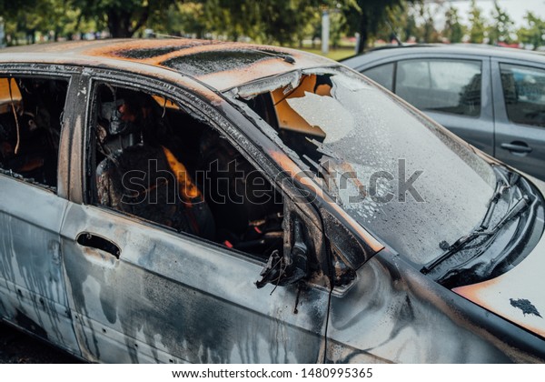 Vandalism or\
revenge, burnt car. The consequences of popular protest, burnt car,\
a crime. Car after fire. Auto\
trash