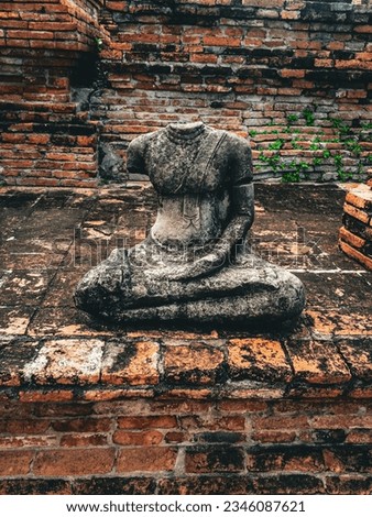 Vandalized Ancient Stone Buddha Statue