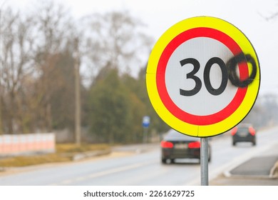 The vandals painted the number zero on a road sign with a speed limit of 30 kilometers per hour. 300 kilometers per hour sign background