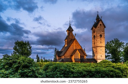 Vang Stave Church or Mountain Church of Our Savior, originally from Norway, reerected in polish town Karpacz. Evening September photo of church with dramatic sky in National Park Karkonoski.  - Powered by Shutterstock