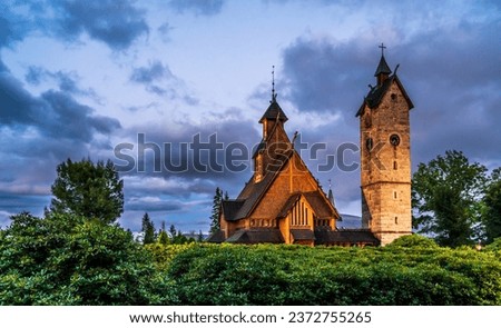 Vang Stave Church or Mountain Church of Our Savior, originally from Norway, reerected in polish town Karpacz. Evening September photo of church with dramatic sky in National Park Karkonoski. 