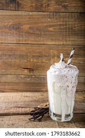 Vanilla Bean Milkshake. Glass With Cold Vanilla Milkshake With Vanilla Beans, Copy Space