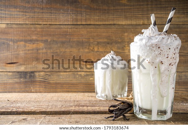 Vanilla bean milkshake. Glass with cold\
Vanilla milkshake with Vanilla beans, copy\
space