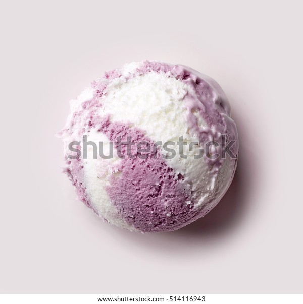 vanilla and blueberry ice cream ball on purple\
background, top view