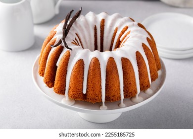 Vanilla bundt cake drizzled with powder sugar glaze with vanilla beans - Powered by Shutterstock
