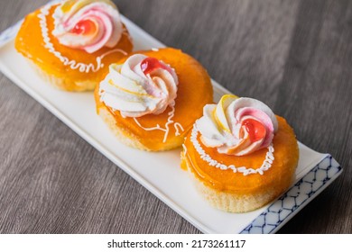 Vanilla Cake With Orange Cream Topping