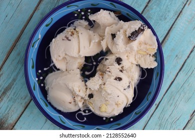 Vanilla And Chocolate Chunks Ice Cream On A Bowl