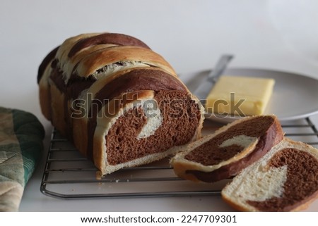 Vanilla Chocolate Swirl Bread. It is a delicious, bakery style bread made with dough of vanilla, chocolate and sweet milk. Dough is swirled together to create a beautiful marbled effect before baking