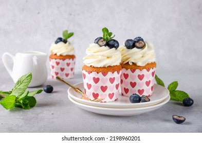 Vanilla cupcakes with blueberries and with cream cheese frosting. Homemade cakes - Shutterstock ID 2198960201