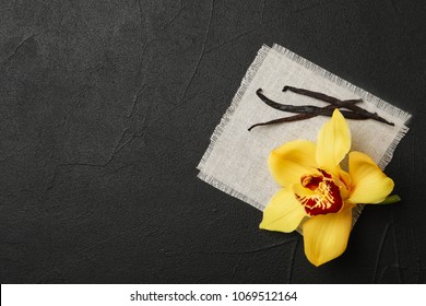 Vanilla Flower And Sticks On Dark Background