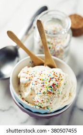 Vanilla Ice Cream In Bowl With Colorful Sprinkles