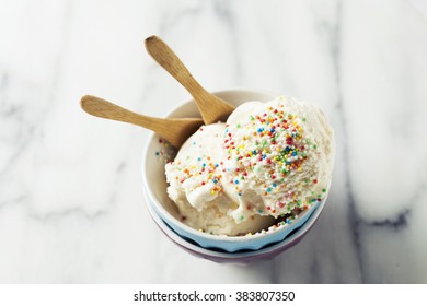 Vanilla Ice Cream In Bowl With Colorful Sprinkles