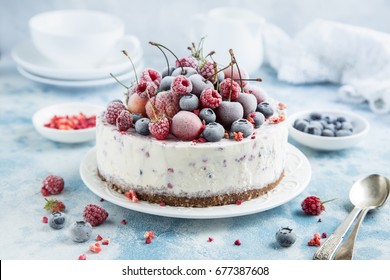 vanilla ice cream cake with frozen berries , selective focus - Powered by Shutterstock