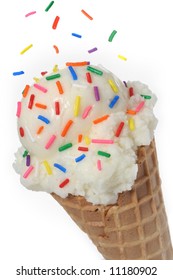 Vanilla ice cream cone topped with colorful sprinkles