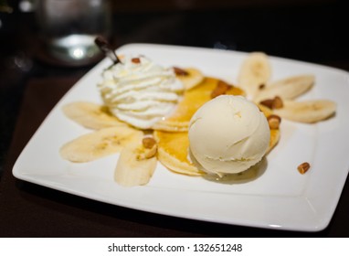 Vanilla Ice Cream On Pancake Banana Split On White Dish