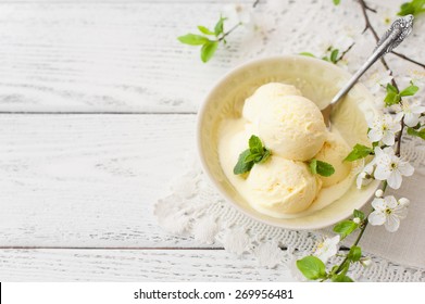 Vanilla ice cream on wooden background