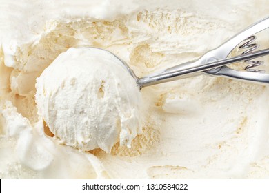 Vanilla Ice Cream With A Scoop In  Container As Background. Macro. Scooped Out Ice-cream,  Top View.